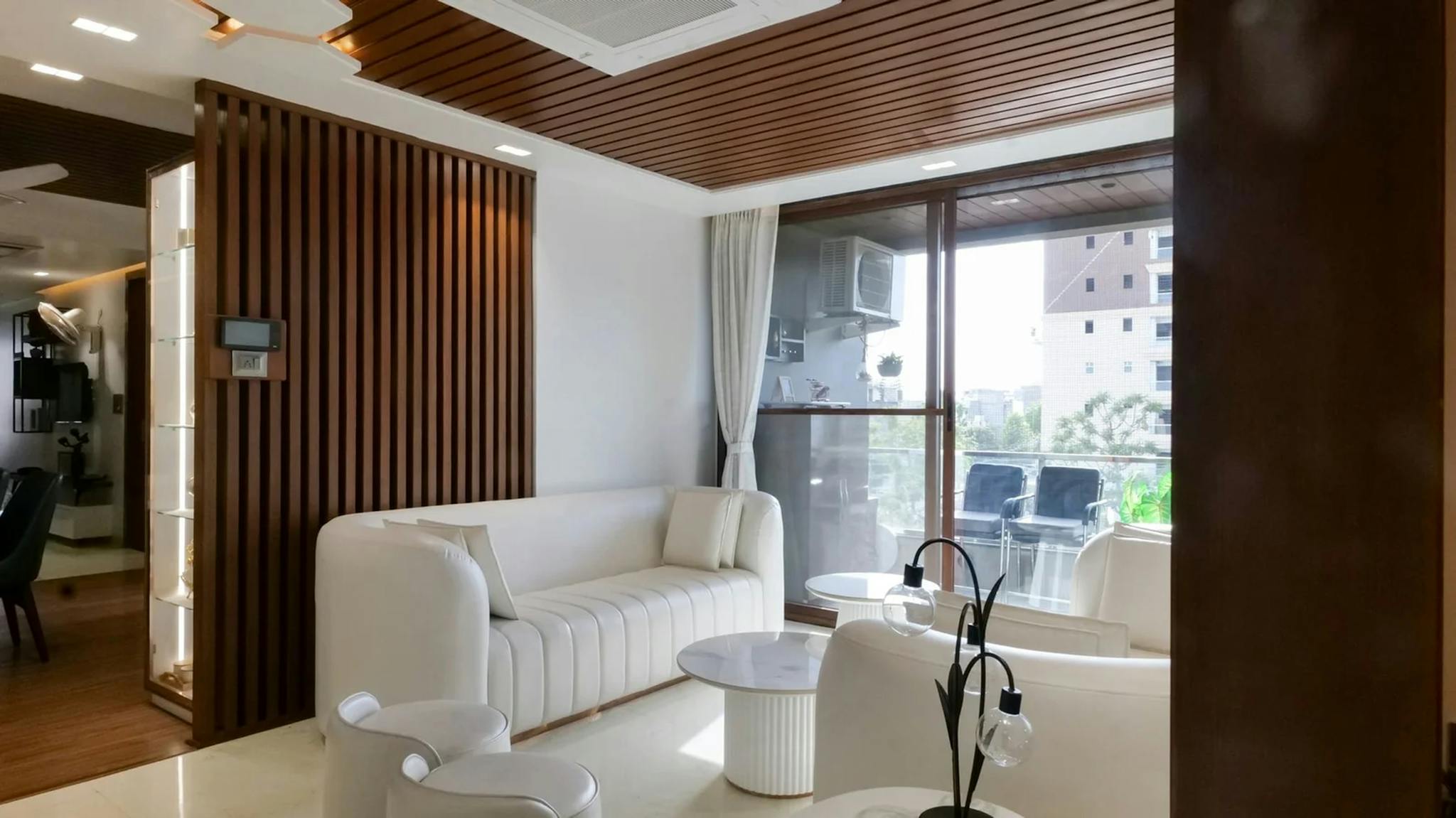 Contemporary Indian living room featuring elegant sheesham wood furniture and decor.